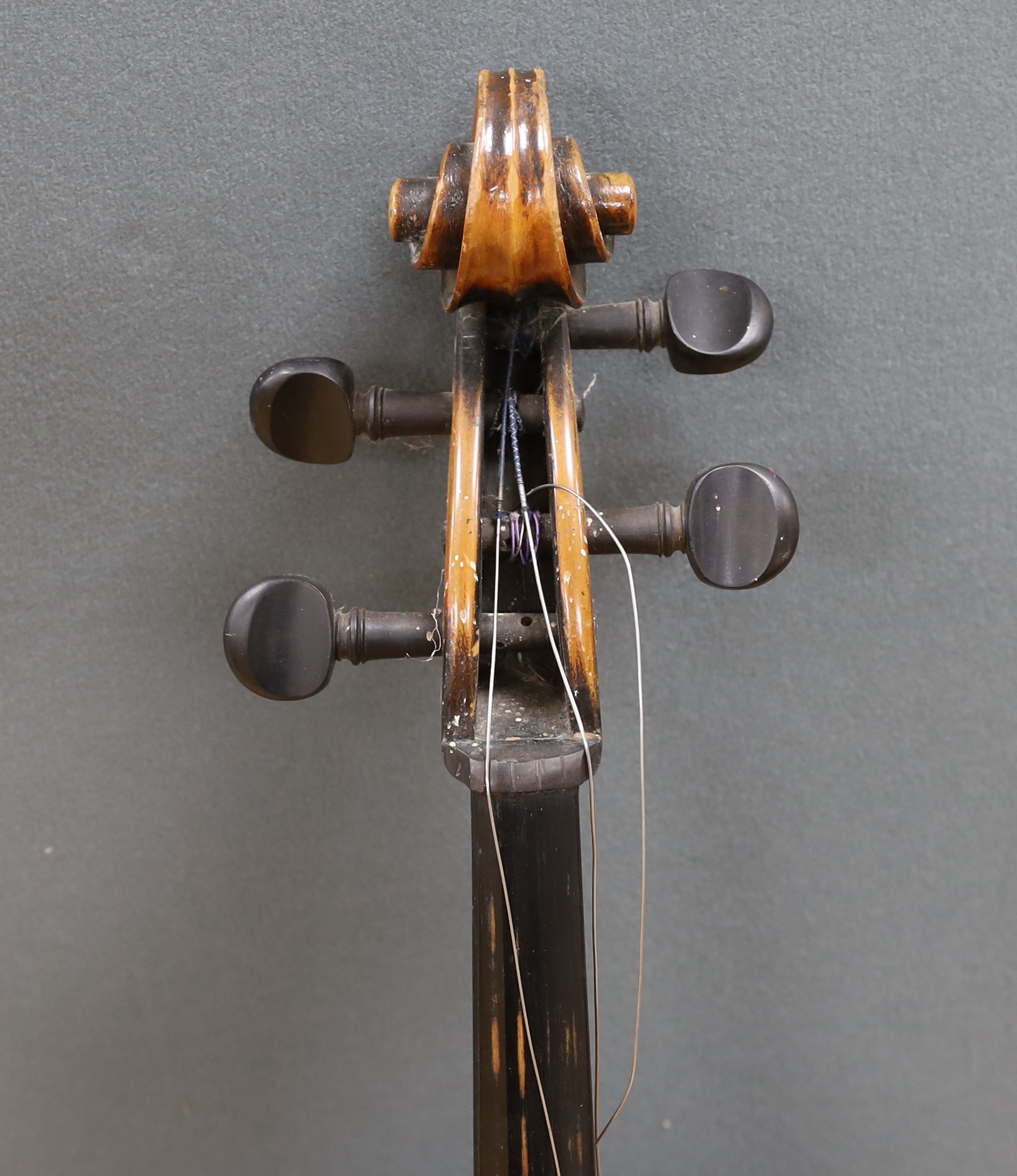 A full size cello labelled Adolf Stowaller, cased, 132cm high